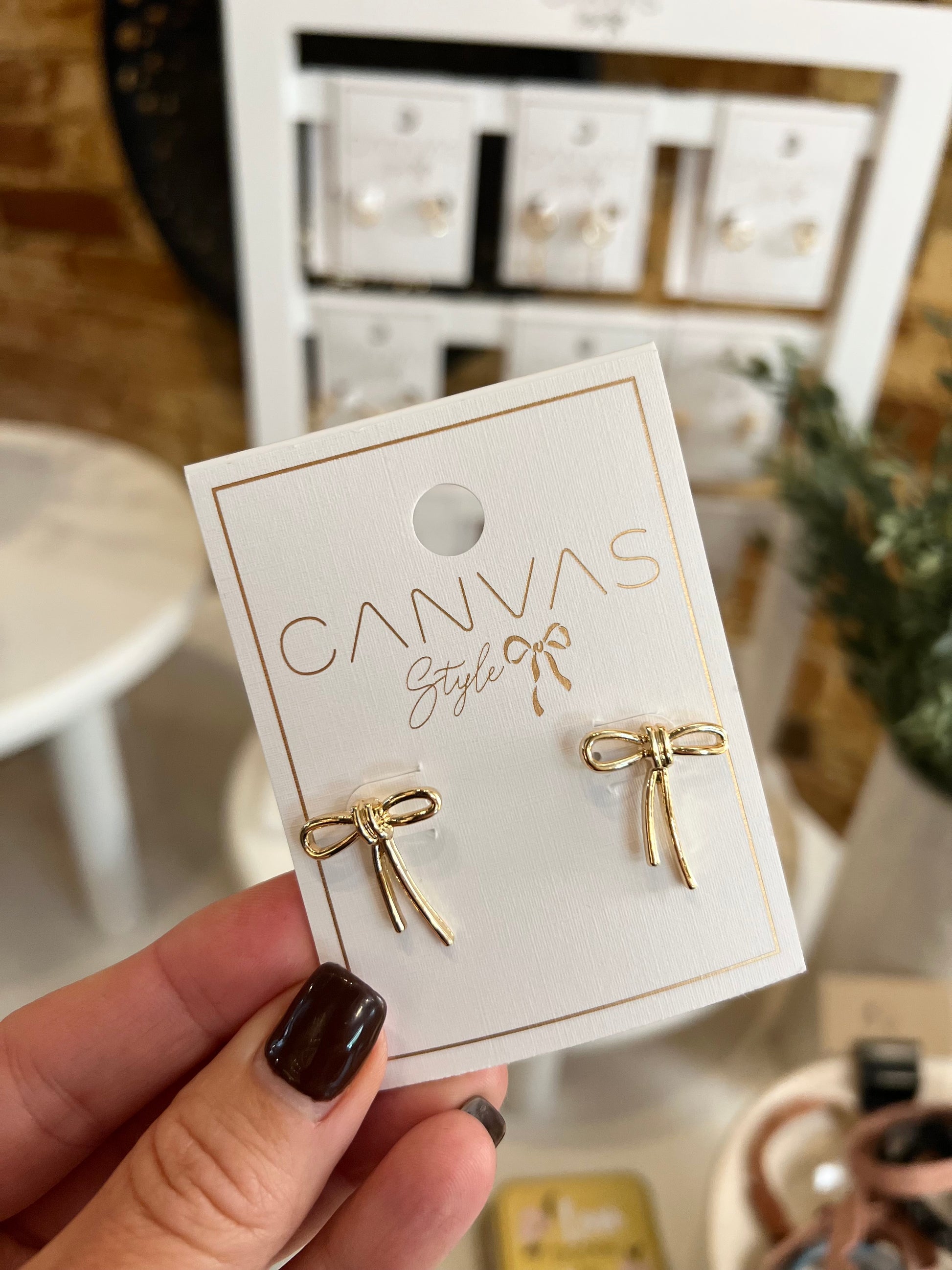 Lopsided Bow Stud Earrings in Shiny Gold