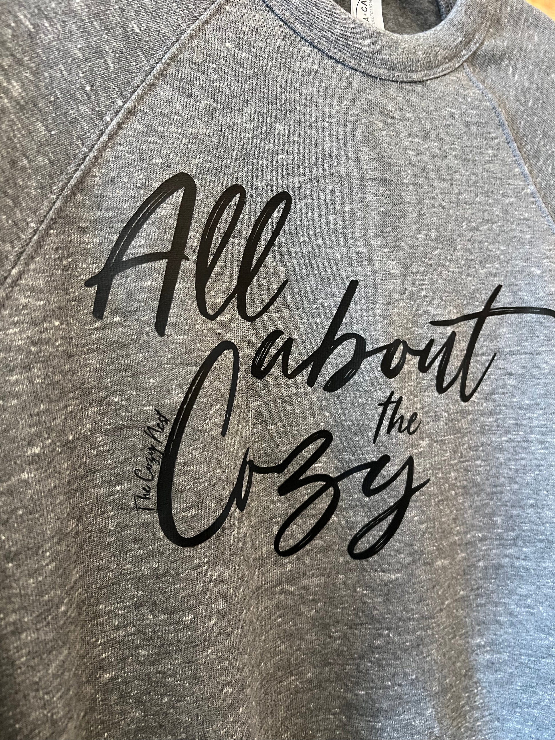 All About The Cozy Sweatshirt W Black Lettering